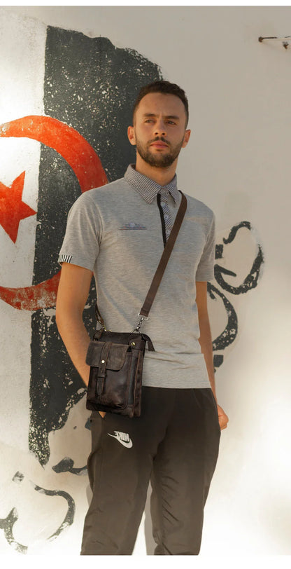 A premium cowhide leather shoulder bag with a compact and versatile design, suitable for various occasions and outdoor activities.