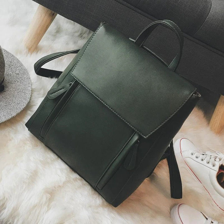 Versatile British-inspired shoulder bag made from high-quality PU leather with a spacious main compartment, convenient pockets, and an adjustable strap