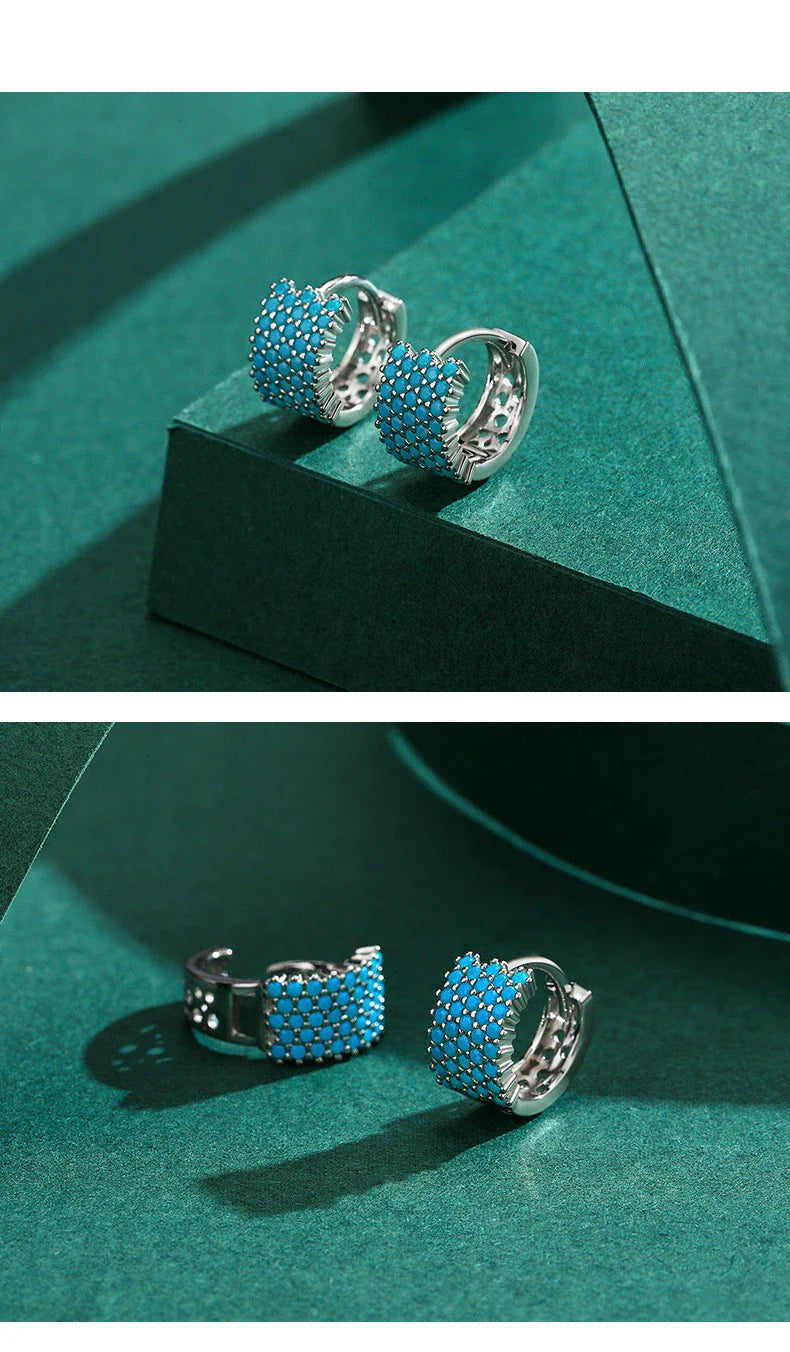 Pair of elegant silver hoop earrings with a micro-insert design, perfect for adding a touch of sophistication to any outfit.