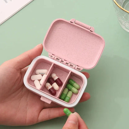 Compact, portable pill organizer with three separate compartments for organizing daily medications, vitamins, and supplements