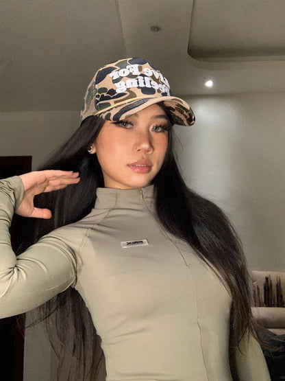 Camo curved brim hat with embroidered 'Live For Feeling' slogan, adjustable size for all-day comfort and style