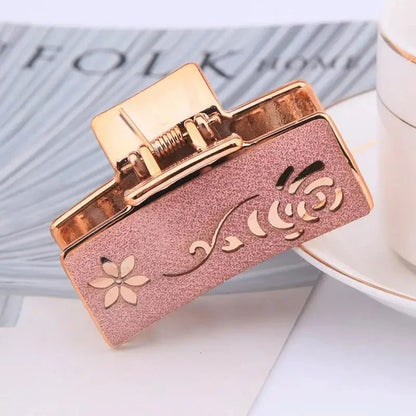 Elegant floral hair claw accessory for women, featuring a premium canvas and rubber design in a stylish brown color