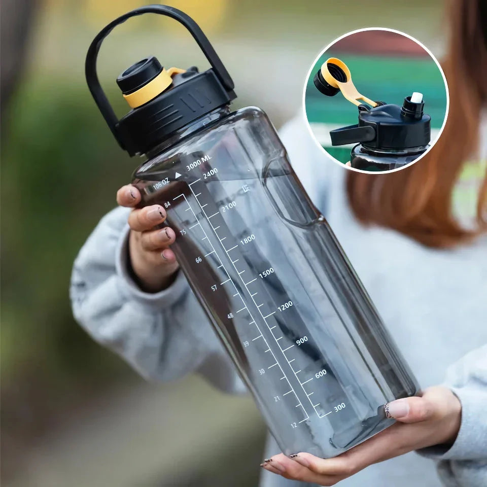 A large capacity sports water bottle with a straw lid and time stamps, designed for ultimate hydration and convenience.