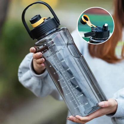 A large capacity sports water bottle with a straw lid and time stamps, designed for ultimate hydration and convenience.