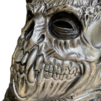 A terrifying Halloween mask made of latex, featuring a skull design with horns to create a dark, demonic appearance.