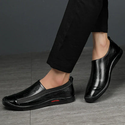 A pair of durable and stylish men's casual leather shoes in black, featuring a pointed toe, low upper, and rubber sole.