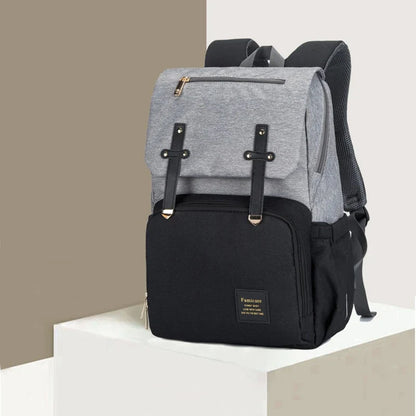 Premium diaper backpack with insulated pockets, stroller attachment, and USB charging port