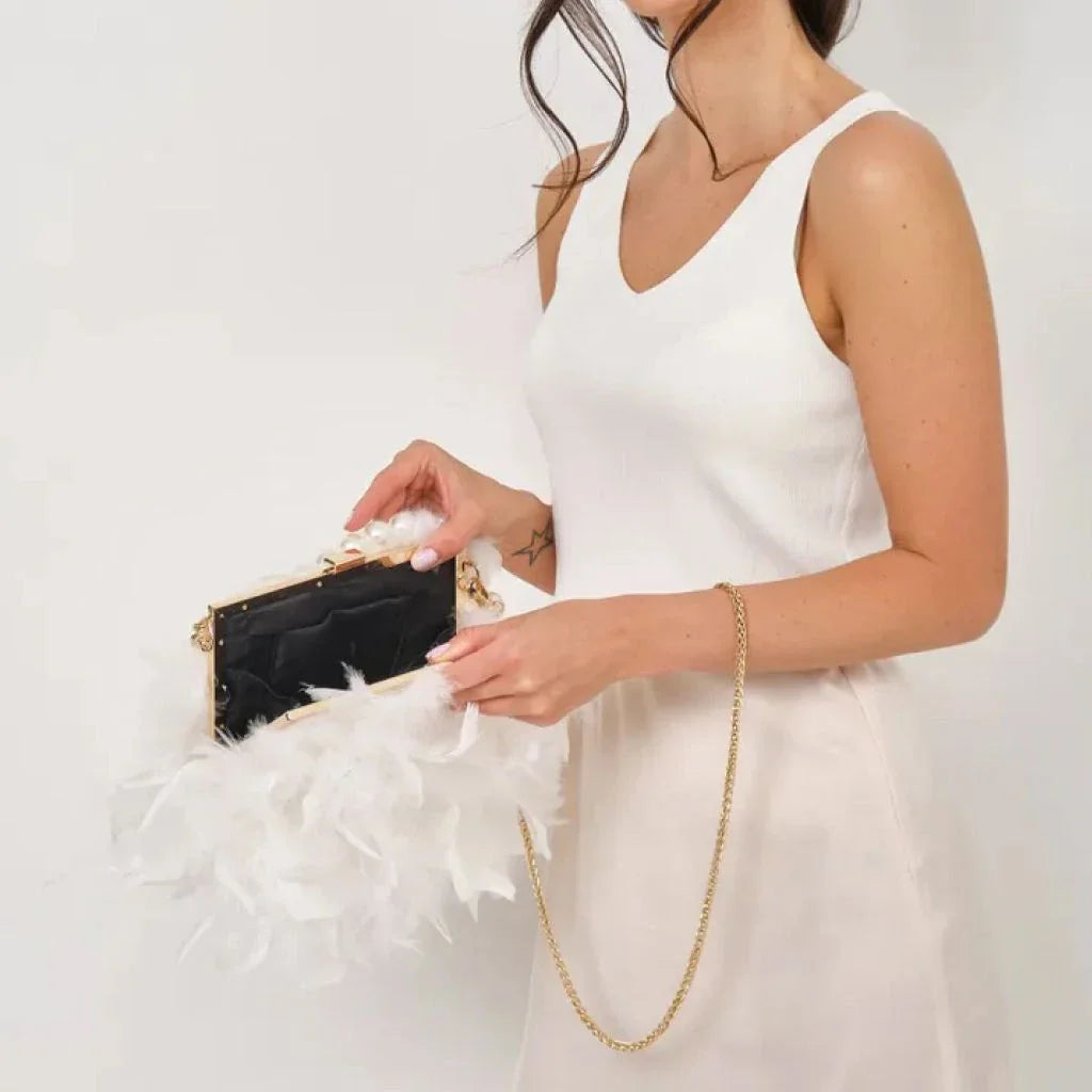 Elegant feather clutch bag with pearl embellishments and metal chain details