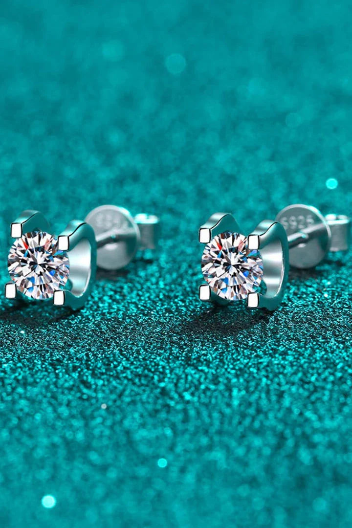 A pair of 1 carat moissanite stud earrings made of 925 sterling silver with a rhodium plating for a dazzling shine.