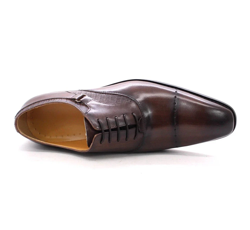 Premium handcrafted leather oxfords in brown with a pointed toe design, suitable for business and formal occasions.