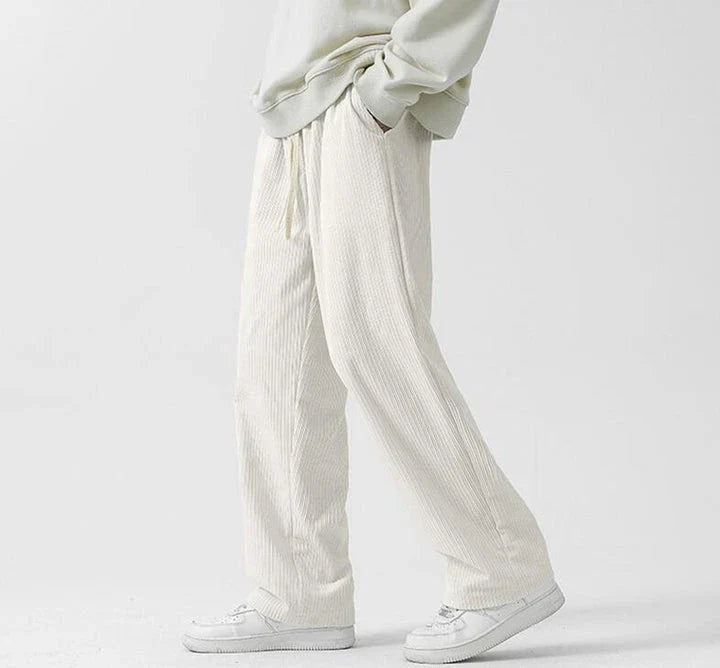 Fleece-lined corduroy pants in various colors, featuring a relaxed, straight-leg fit for all-day comfort and warmth.