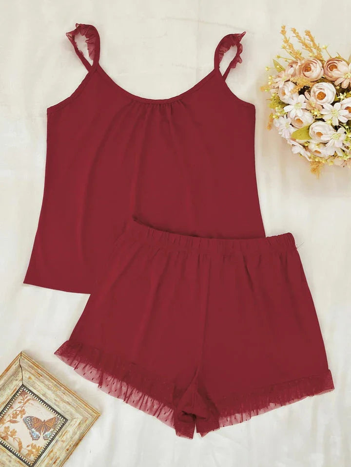 Chic Sleeveless Top and Shorts Set in Black, featuring a flattering scoop neckline, slightly stretchy fabric, and adjustable waistband for a comfortable, customized fit.
