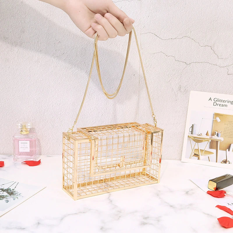 Metal shoulder bag with iron mesh design, adjustable chain strap, and compact size for versatile wear
