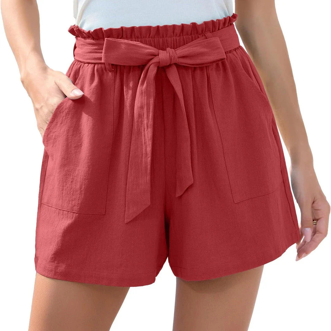 Ruffle bow waist tie shorts in black, made of lightweight and breathable polyester fabric, with convenient pockets for storage