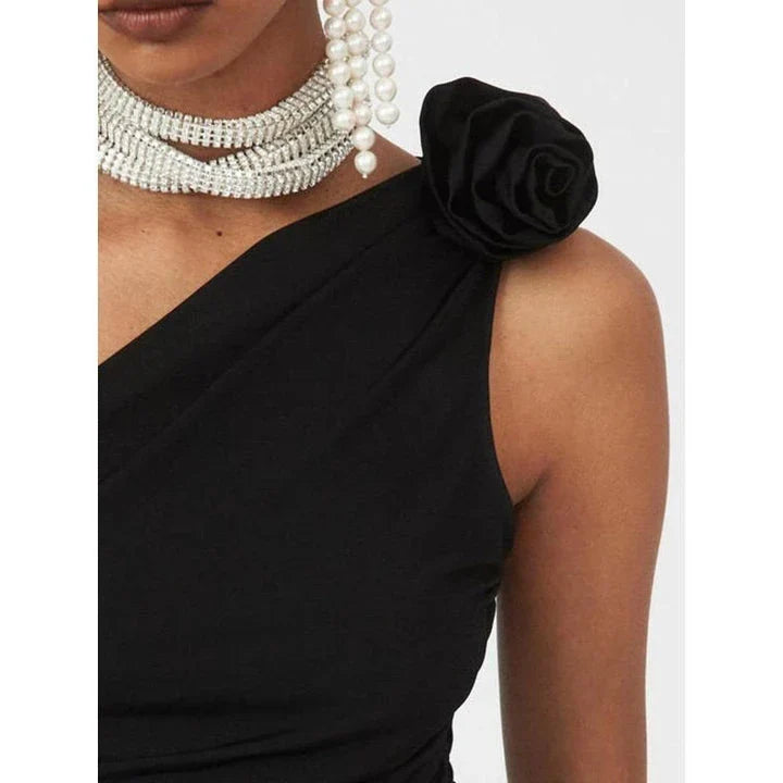 Chic diagonal shoulder knit tank top with 3D rose detail for a sophisticated yet playful summer style