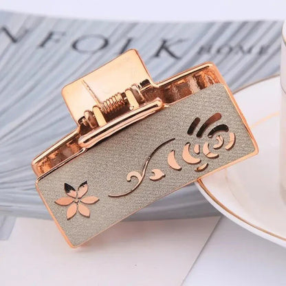 Elegant floral hair claw accessory for women, featuring a premium canvas and rubber design in a stylish brown color