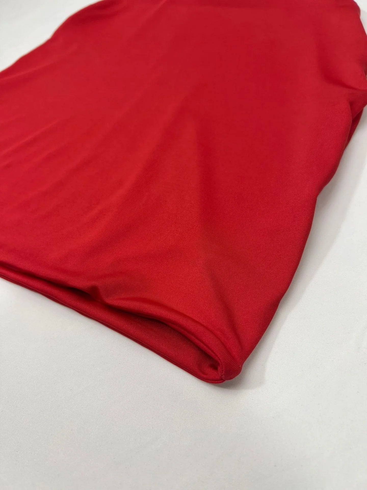 Backless midi skirt with halter neckline and trendy cutouts, available in white, black, and red colors