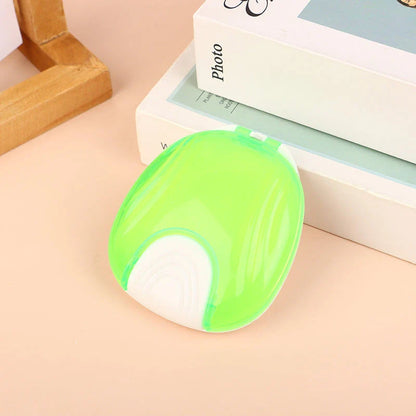 Compact, transparent dental retainer storage box with a push-to-open mechanism for easy access to dental appliances