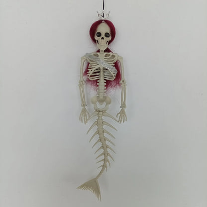 Mermaid bone pendant in various colors, including brown, dark purple, burgundy, and lake blue, hanging outdoors for Halloween decoration