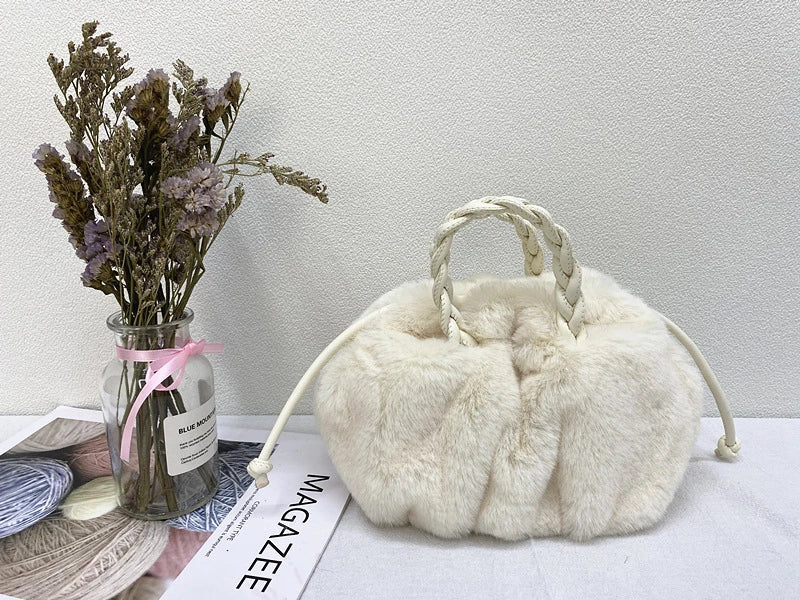 Elegant pleated leather and mink fur handbag in various colors, featuring a chic and modern cloud-like design