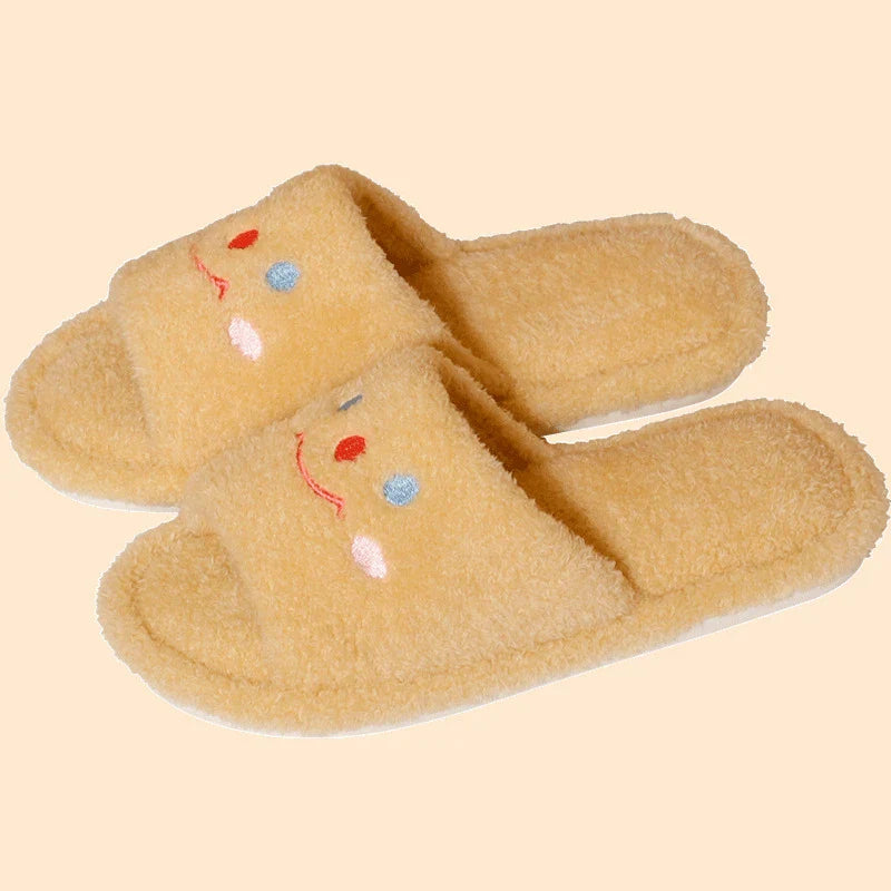 Cozy plush slippers with a smiling face design for comfortable indoor wear