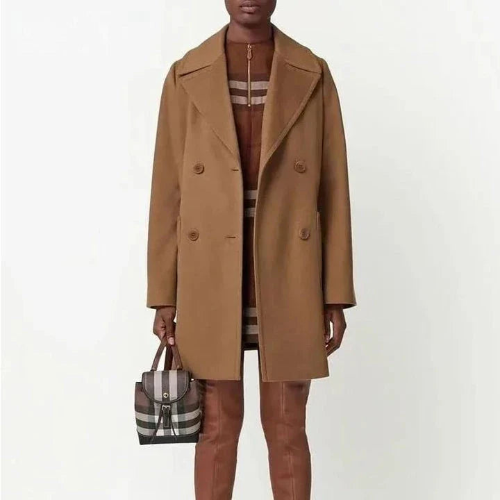 A stylish, mid-length double-breasted overcoat in a rich brown color, designed with a turn-down collar and practical patch pockets for a polished, versatile look.