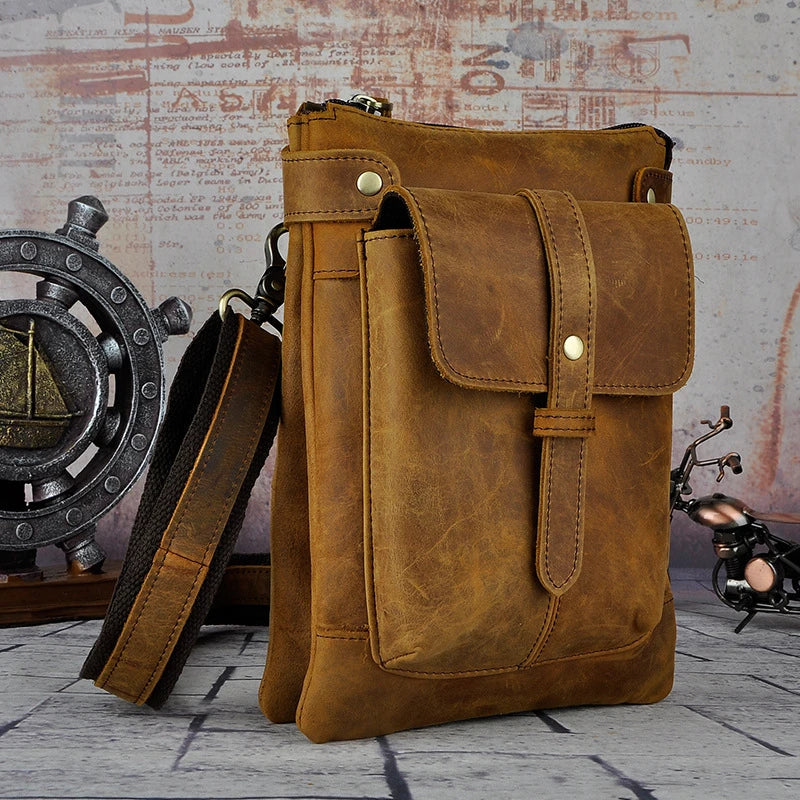 A premium cowhide leather shoulder bag with a compact and versatile design, suitable for various occasions and outdoor activities.