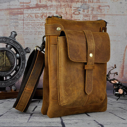 A premium cowhide leather shoulder bag with a compact and versatile design, suitable for various occasions and outdoor activities.