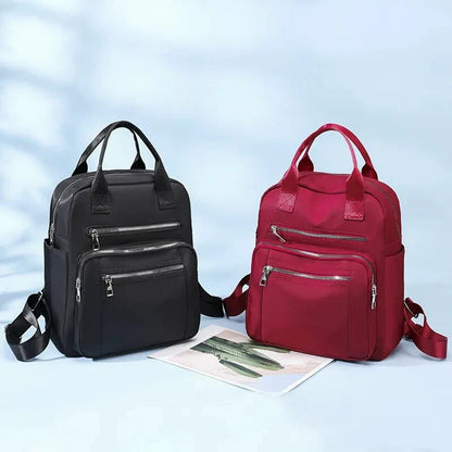 A stylish and durable Oxford cloth backpack with multiple compartments for organized storage and a sleek, portable design.