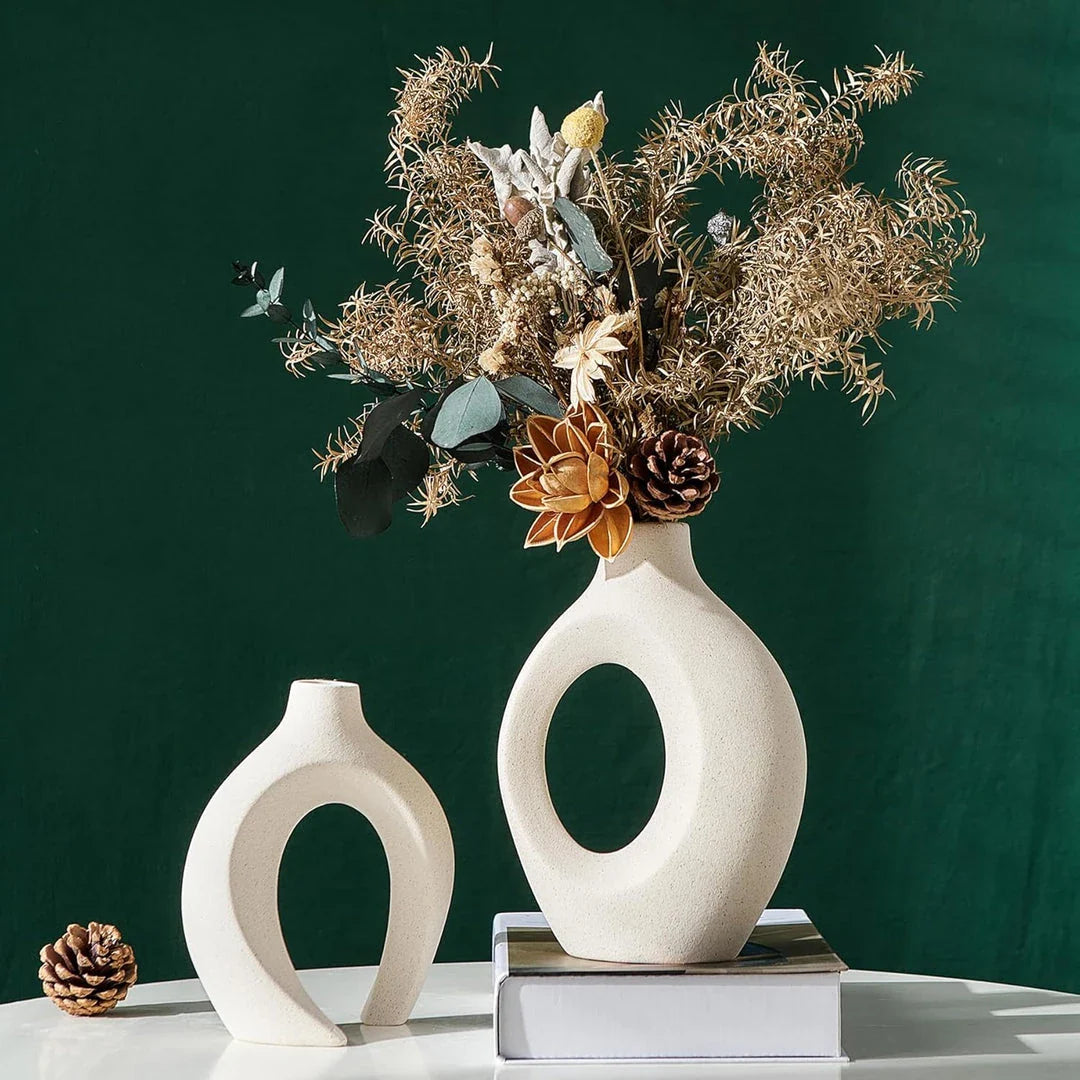 A set of two modern, minimalist white ceramic vases with a textured finish, designed to elevate any home decor.