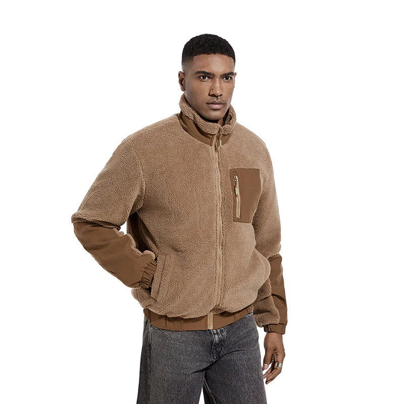 A cozy and stylish men's fleece jacket with a standing collar and convenient side pockets, available in a range of classic colors.