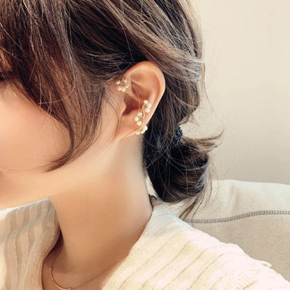 Elegant hand-woven freshwater pearl earrings with a unique geometric design, perfect for adding a touch of sophistication to any outfit.