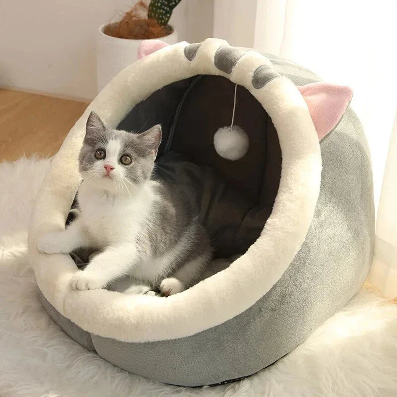 Cozy cat bed with plush cushion in various colors, providing a warm and comfortable winter retreat for cats and small dogs.