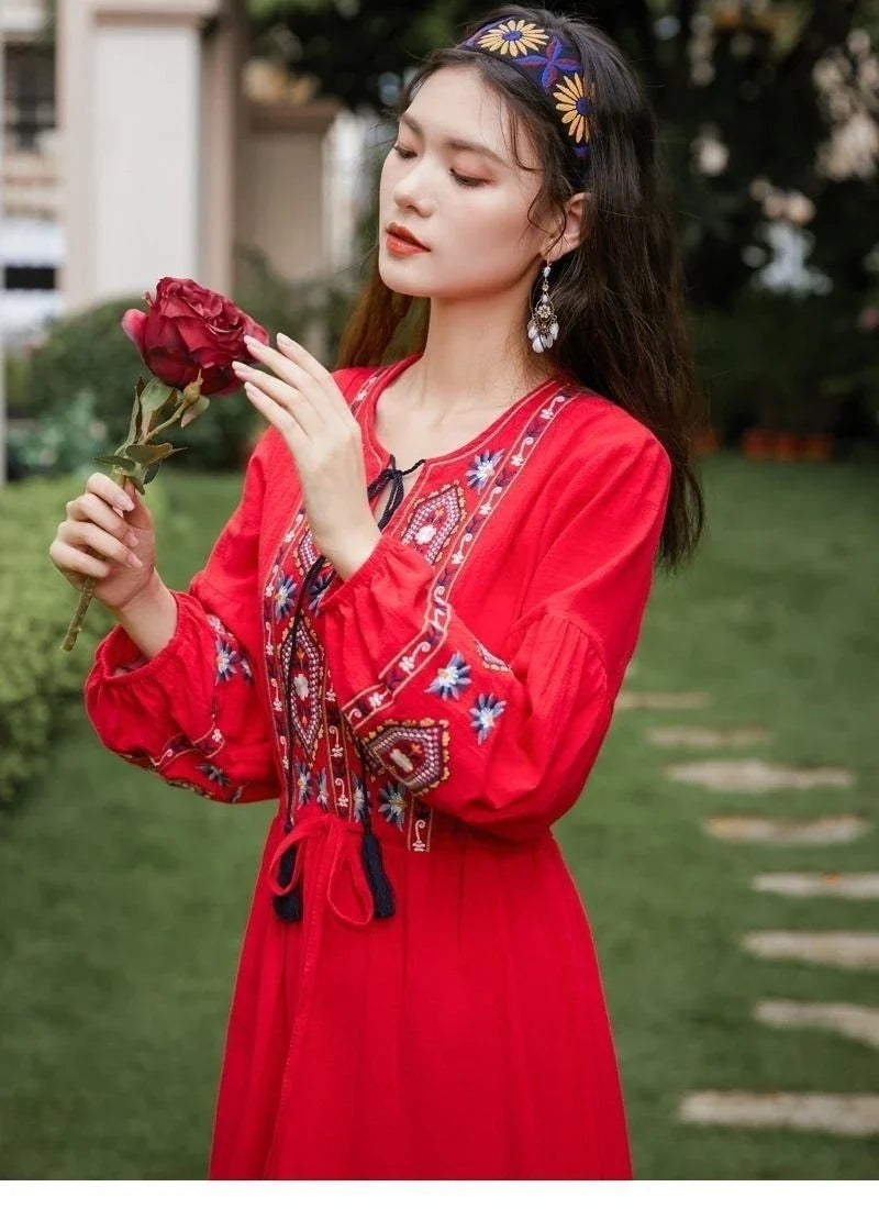 Elegant embroidered cotton-linen dress with tassels, featuring a waist-cinching A-line silhouette in vibrant colors