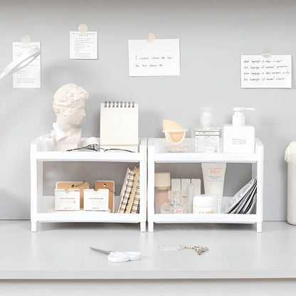 Sleek white desktop organizer with two-tier storage compartments for keeping office supplies, cosmetics, and other essentials neatly organized on a desk or countertop