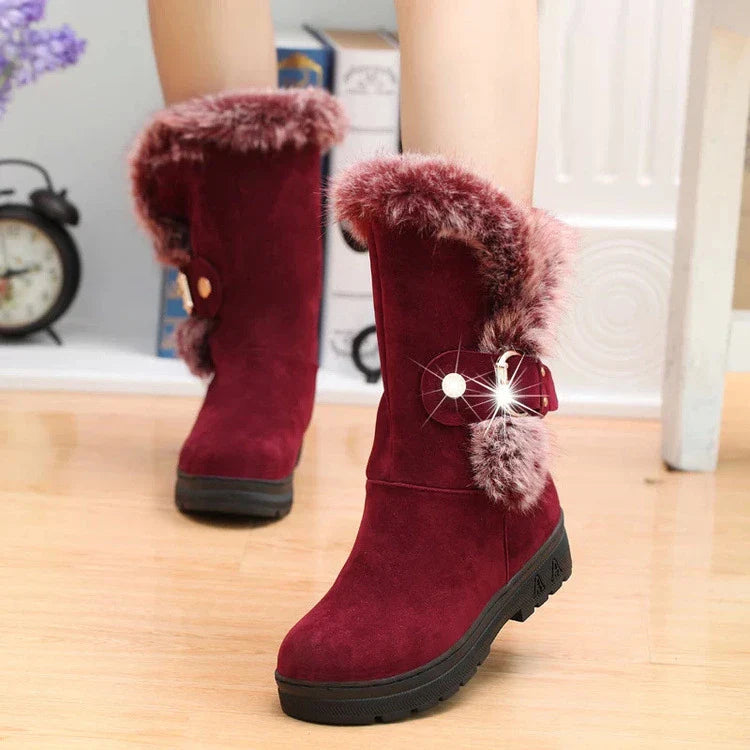 Women's winter snow boots in black, brown, and wine red colors with flocking upper material, wedge heel, and buckle closure