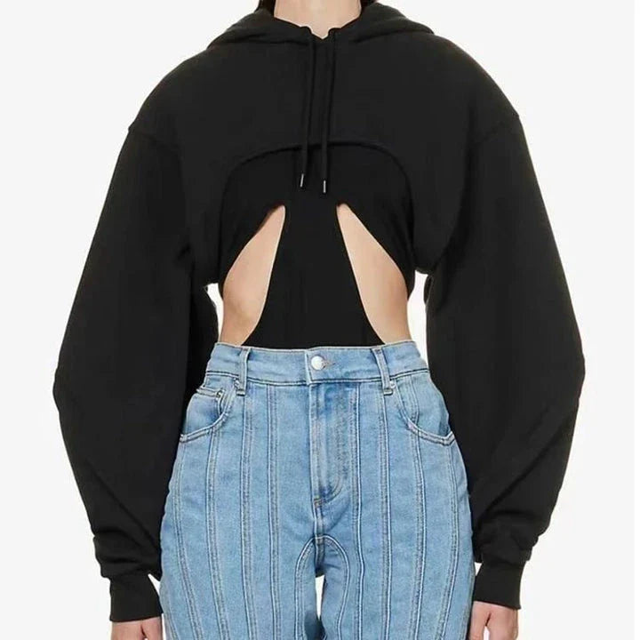 Fashionable hooded sweatshirt for women with open sleeves, asymmetrical decoration, and a relaxed, comfortable fit