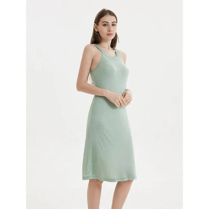 Elegant silk-blend halter neck midi dress in green and white colors, showcasing a chic and versatile design for modern American women.