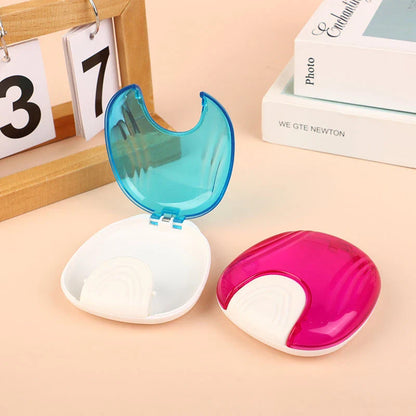 Compact, transparent dental retainer storage box with a push-to-open mechanism for easy access to dental appliances