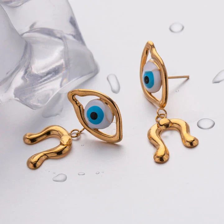 Pair of 18K gold plated stainless steel asymmetrical devil's eye earrings with a dripping oil finish