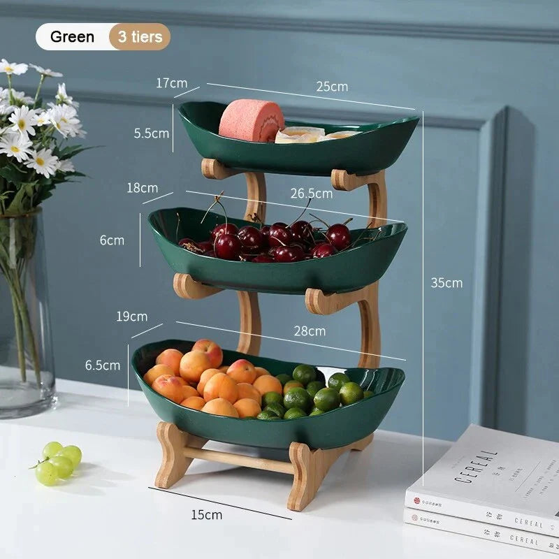 Three-tier plastic and bamboo fruit display tray with unique leaf-shaped design, available in white, beige, and green colors