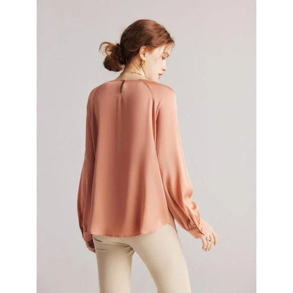 Elegant silk blend raglan sleeve blouse with timeless design and flattering fit for modern women