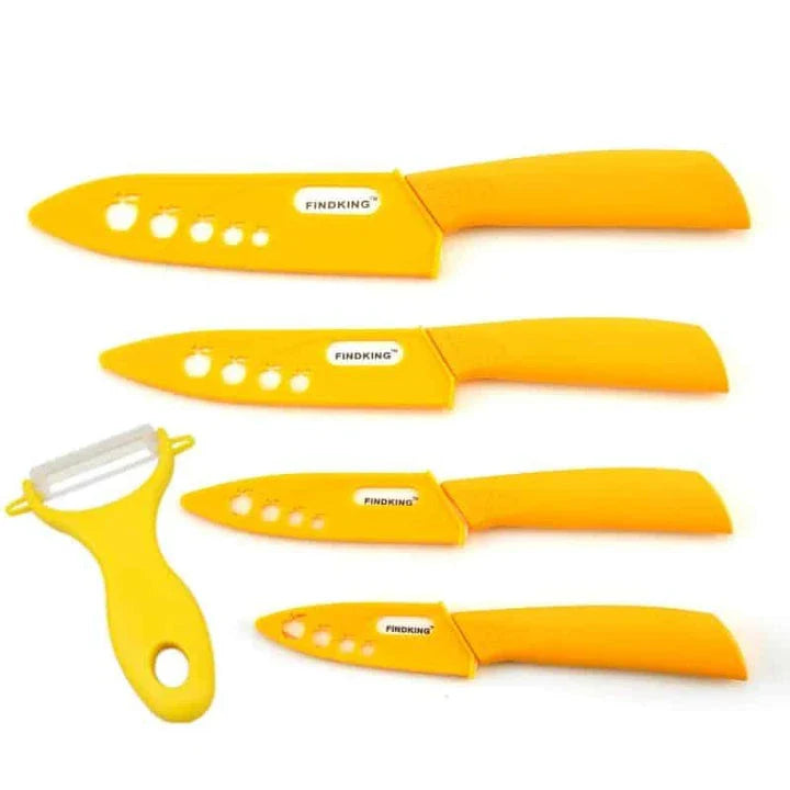 Vibrant ceramic knives in various colors, including red, blue, green, black, yellow, and orange, arranged on a white background.