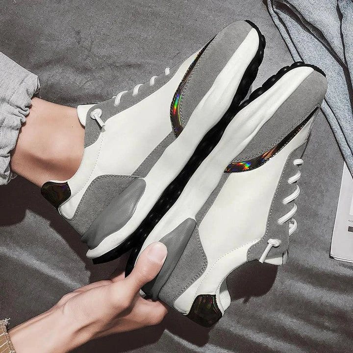 A pair of stylish, breathable men's casual shoes with a thick, durable rubber sole for enhanced comfort and traction.