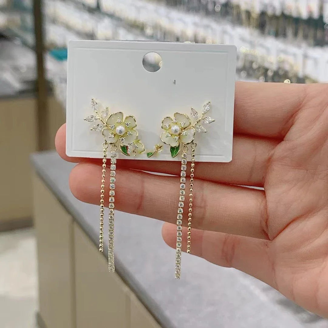 Elegant floral zircon and pearl tassel earrings in gold and silver tones