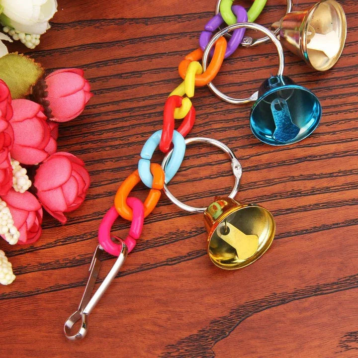 Hanging acrylic bird bells that sway and chime, attracting and entertaining backyard birds