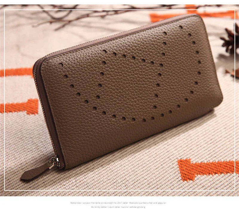 Premium cowhide leather clutch bag with lychee pattern design, featuring a medium-sized square shape and versatile style