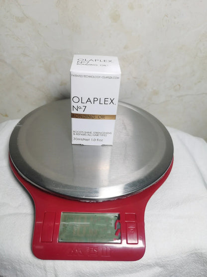 Bottle of Hair Smoothing and Anti-Heat Repair Oil for nourishing and protecting damaged hair