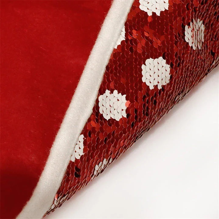 Festive Christmas tree skirt with red and white polka dot pattern and shimmering sequins