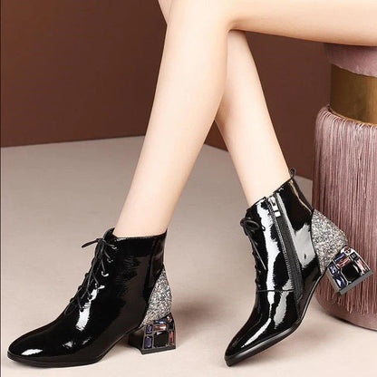 Elegant patent leather pumps with rhinestone embellishments and thick, high heels
